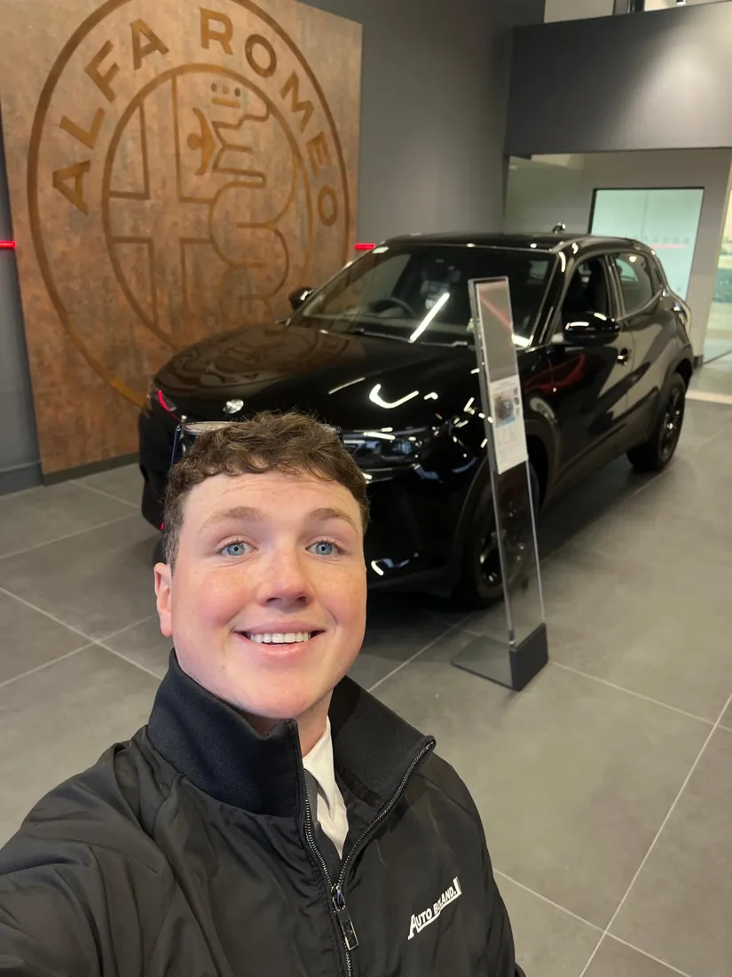 Dylan in his Autobolands jacket on the showroom floor